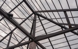 A structure made of steel to support the weight of the roof of the house.